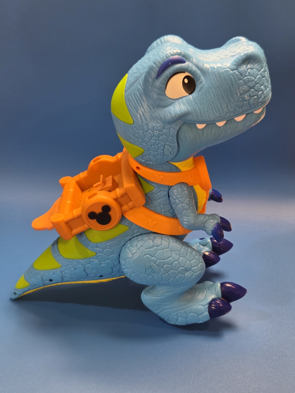 Blue Dinosaur Ride-On Toy with Orange Harness